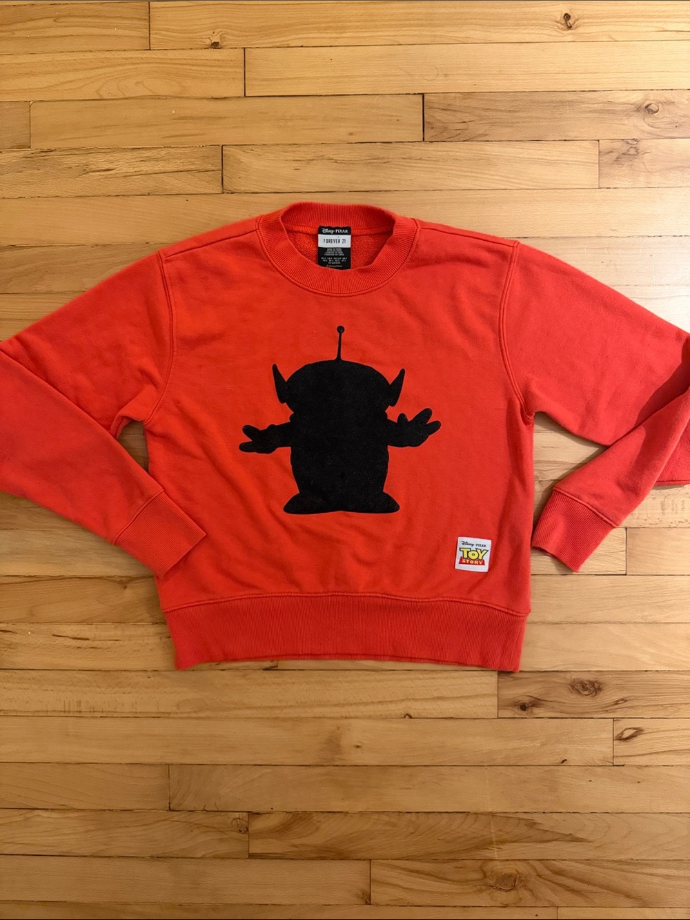Disney Orange Toy Story Crewneck Sweatshirt with Black Alien Silhouette
